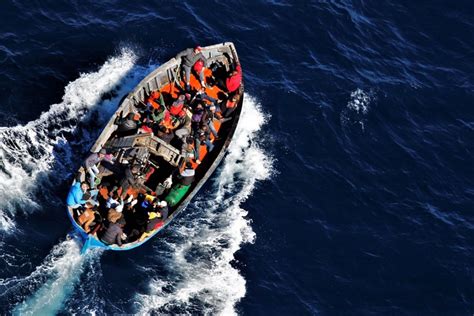 The Italian island of Lampedusa sees 5,000 migrants arriving in 100-plus boats in a single day